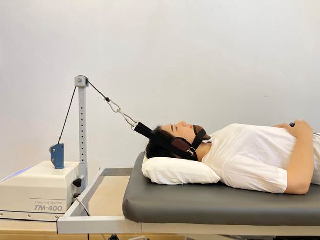 A person lying on a bed with a device attached to her headAI-generated content may be incorrect.